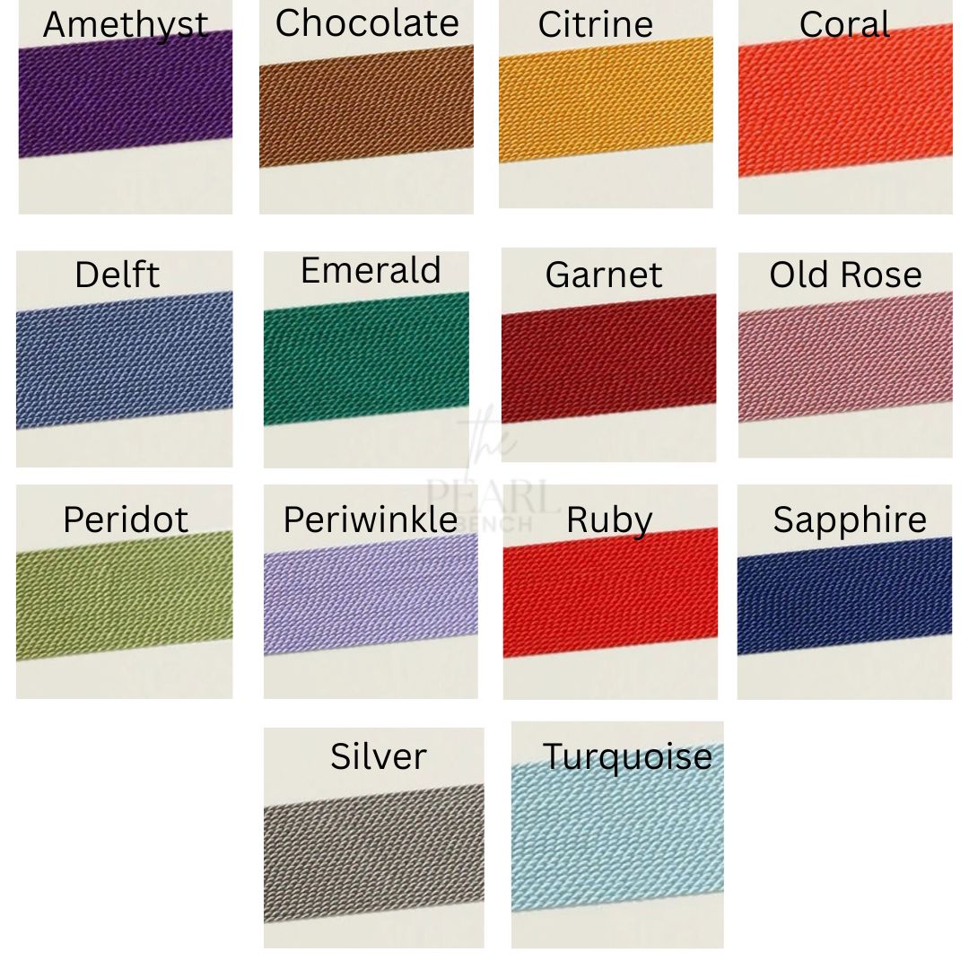 A colour chart showing multiple pearl silk colour options labeled Amethyst, Chocolate, Citrine, Coral, Delft, Emerald, Garnet, Old Rose, Peridot, Periwinkle, Ruby, Sapphire, Silver, and Turquoise, arranged in a grid on a white background.